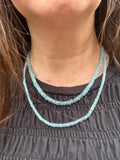 The necklace is for the longer Aquamarine strand. 